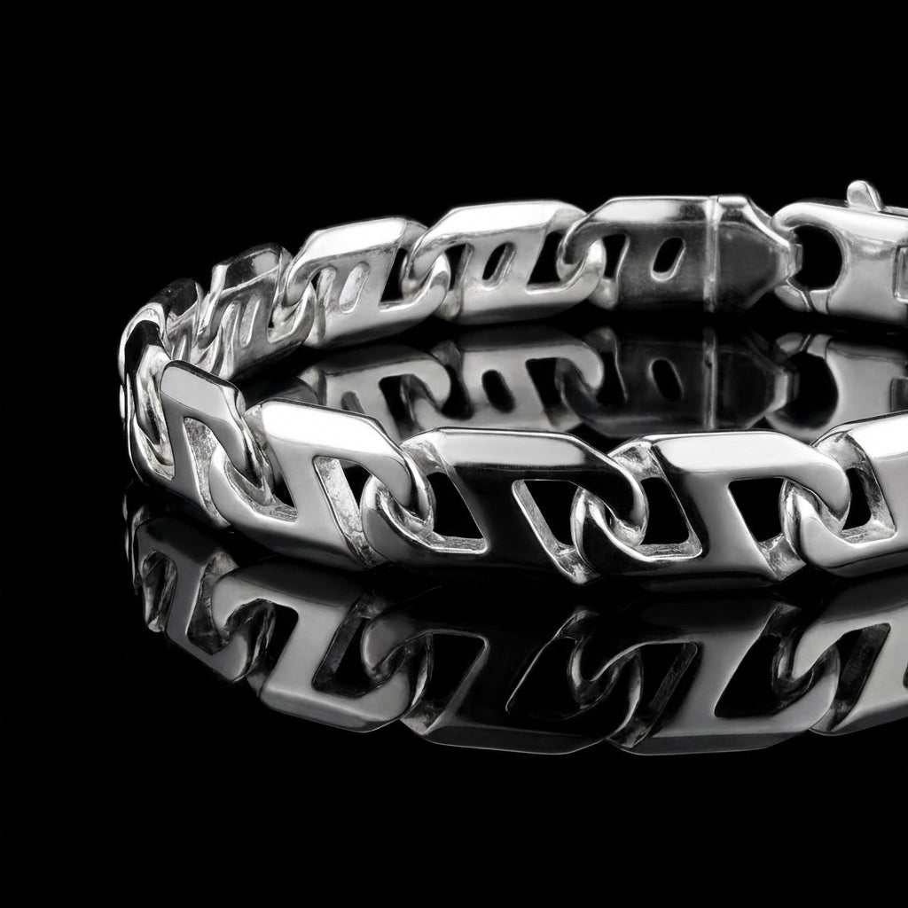Product photo of a silver mens bracelet laying flat on a mirrored surface.