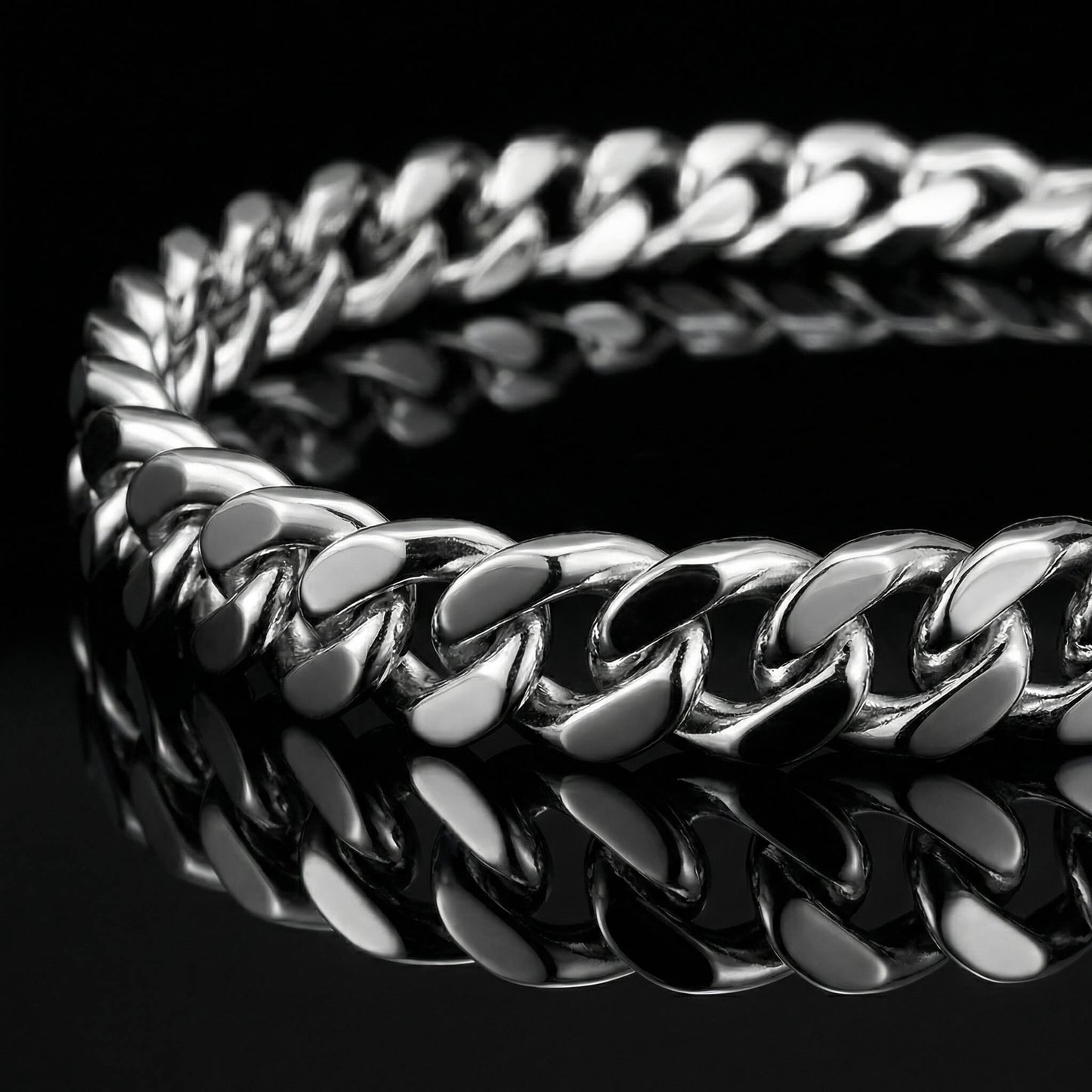 SIlver mens bracelet gourmette link laying flat on mirrored surface.